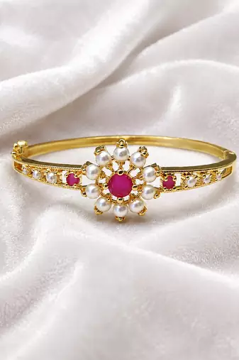 Gold-plated floral bangle with ruby and pearl stones openable free size 