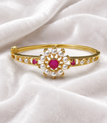 Gold-plated floral bangle with ruby and pearl stones openable free size 