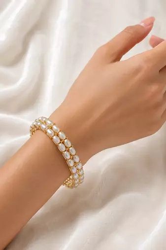 Double row pearl kada bangle with gold-tone setting openable free size 