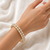 Double row pearl kada bangle with gold-tone setting openable free size 