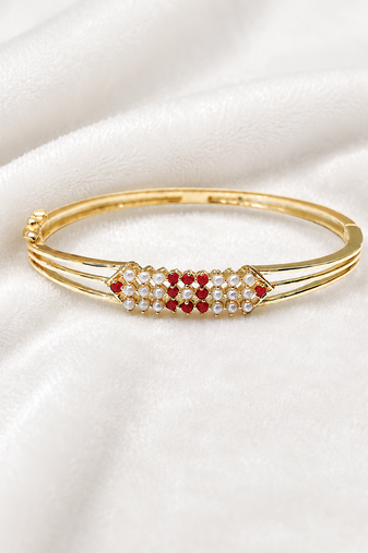 Gold-plated kada bangle with ruby and pearl embellishment openable free size 