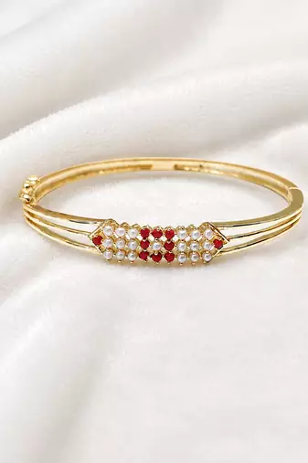 Gold-plated kada bangle with ruby and pearl embellishment openable free size 