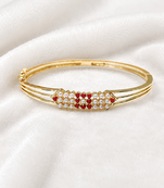 Gold-plated kada bangle with ruby and pearl embellishment openable free size 