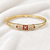 Gold-plated kada bangle with ruby and pearl embellishment openable free size 