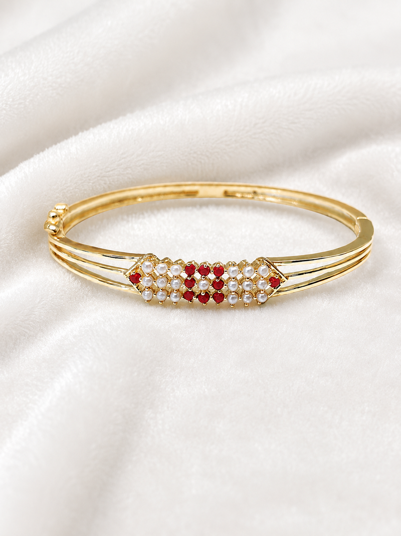 Gold-plated kada bangle with ruby and pearl embellishment openable free size 