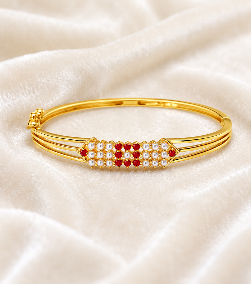 Gold-plated kada bracelet with ruby and pearl embellishments openable free size 