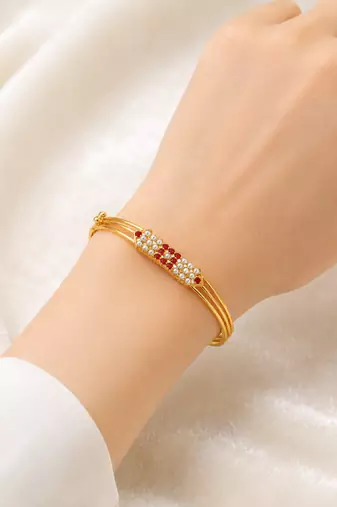 Gold-plated kada bracelet with ruby and pearl embellishments openable free size 