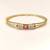 Gold-plated kada bracelet with ruby and pearl embellishments openable free size 