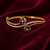 Gold-plated navratan floral kada bracelet with cz stones openable free size 