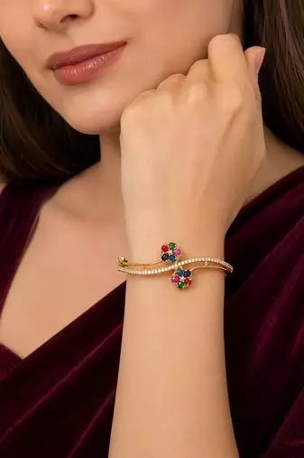 Gold-plated navratan floral kada bracelet with cz stones openable free size 
