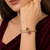 Gold-plated navratan floral kada bracelet with cz stones openable free size 