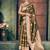 Bottle green soft banarasi silk blend saree with gold zari motifs and contrast blouse