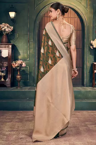 Bottle green soft banarasi silk blend saree with gold zari motifs and contrast blouse