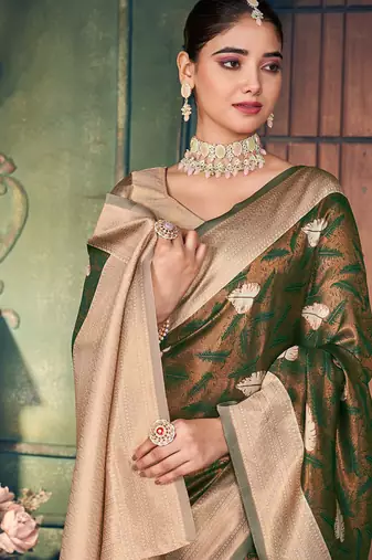 Bottle green soft banarasi silk blend saree with gold zari motifs and contrast blouse