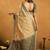 Beige cotton blend zari woven work saree with blouse piece