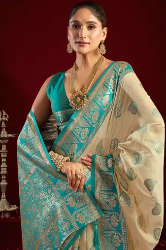 Cream soft banarasi silk blend zari woven saree with blouse piece