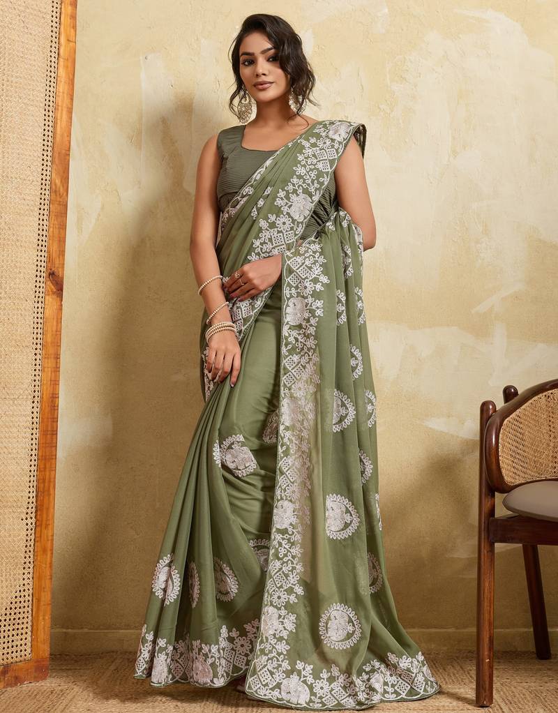 Catching olive green sequins embroidered star georgette party wear saree