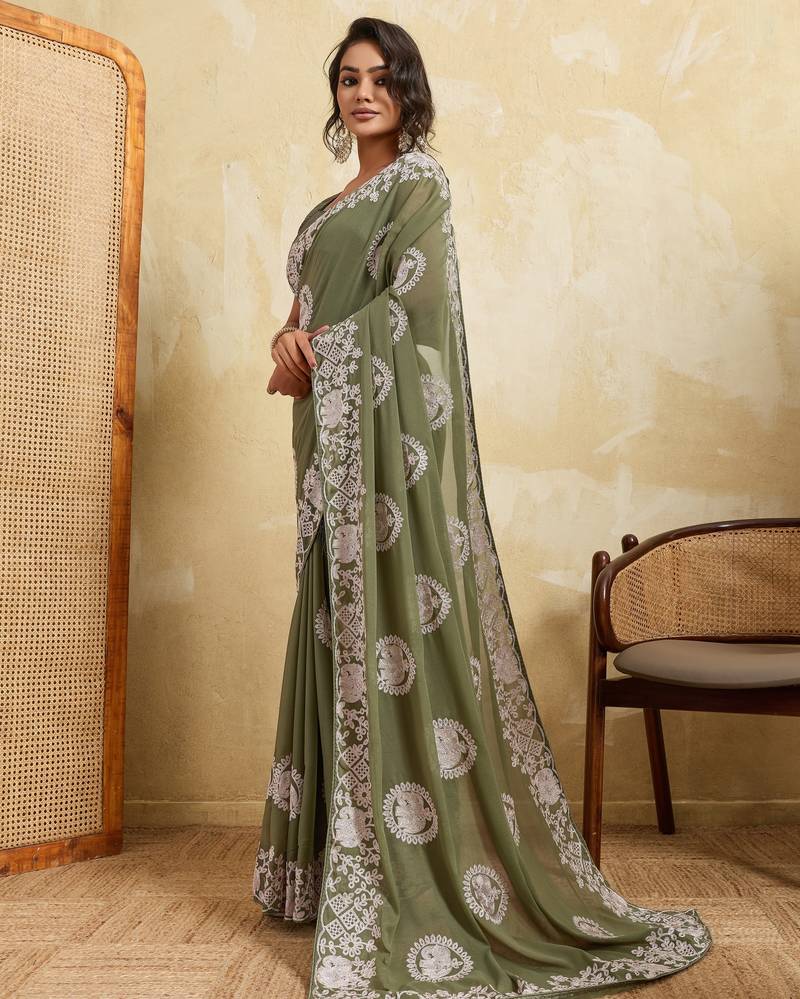 Catching olive green sequins embroidered star georgette party wear saree