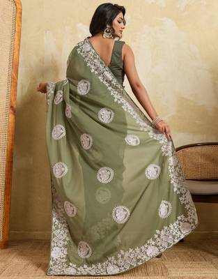 Catching olive green sequins embroidered star georgette party wear saree 5