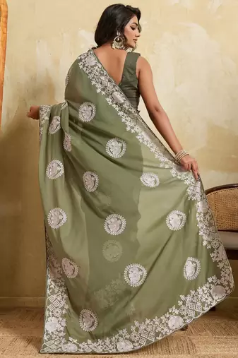 Catching olive green sequins embroidered star georgette party wear saree