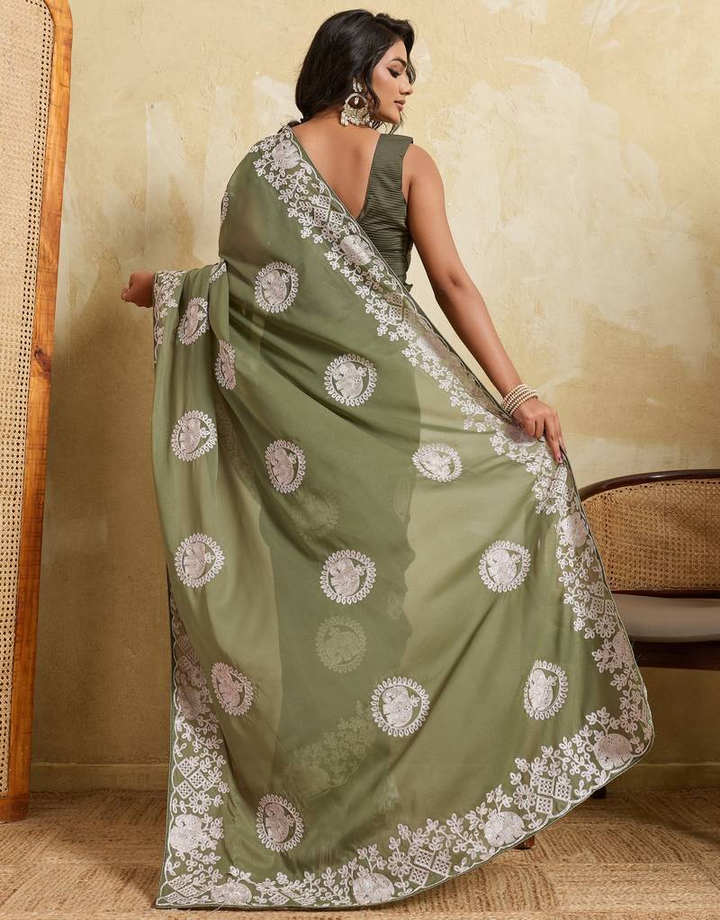 Catching olive green sequins embroidered star georgette party wear saree
