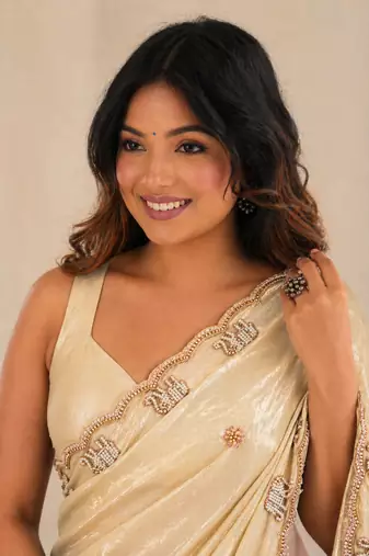 Engaging beige sequins embroidered with bits work frendy satin saree with blouse