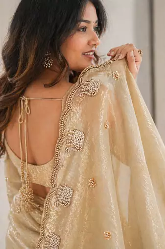 Engaging beige sequins embroidered with bits work frendy satin saree with blouse
