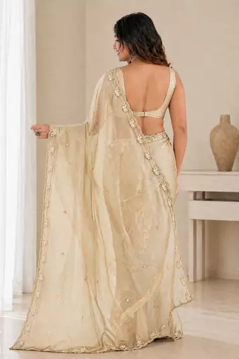 Engaging beige sequins embroidered with bits work frendy satin saree with blouse
