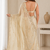 Engaging beige sequins embroidered with bits work frendy satin saree with blouse