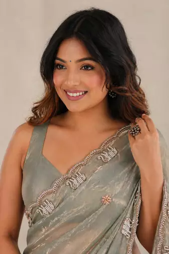 Alluring dusty pink sequins embroidered with bits work frendy satin party wear saree