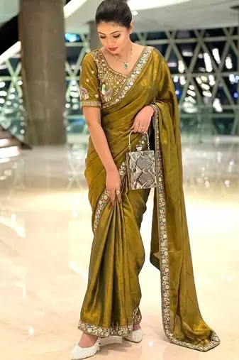 Entrancing green beads sequins and cut-dana embroidered fendy satin festival saree