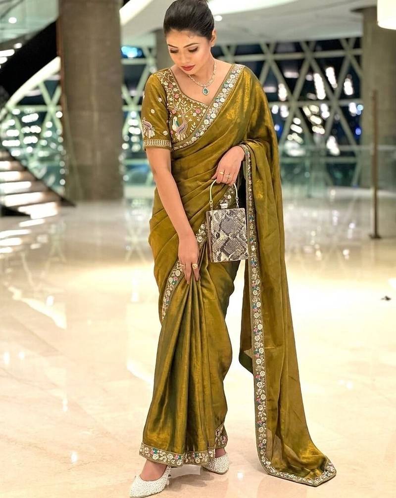 Entrancing green beads sequins and cut-dana embroidered fendy satin festival saree