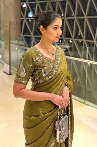 Entrancing green beads sequins and cut-dana embroidered fendy satin festival saree