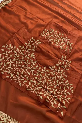 Appetizing orange embroidery cutwork work lace border rangoly silk party wear saree