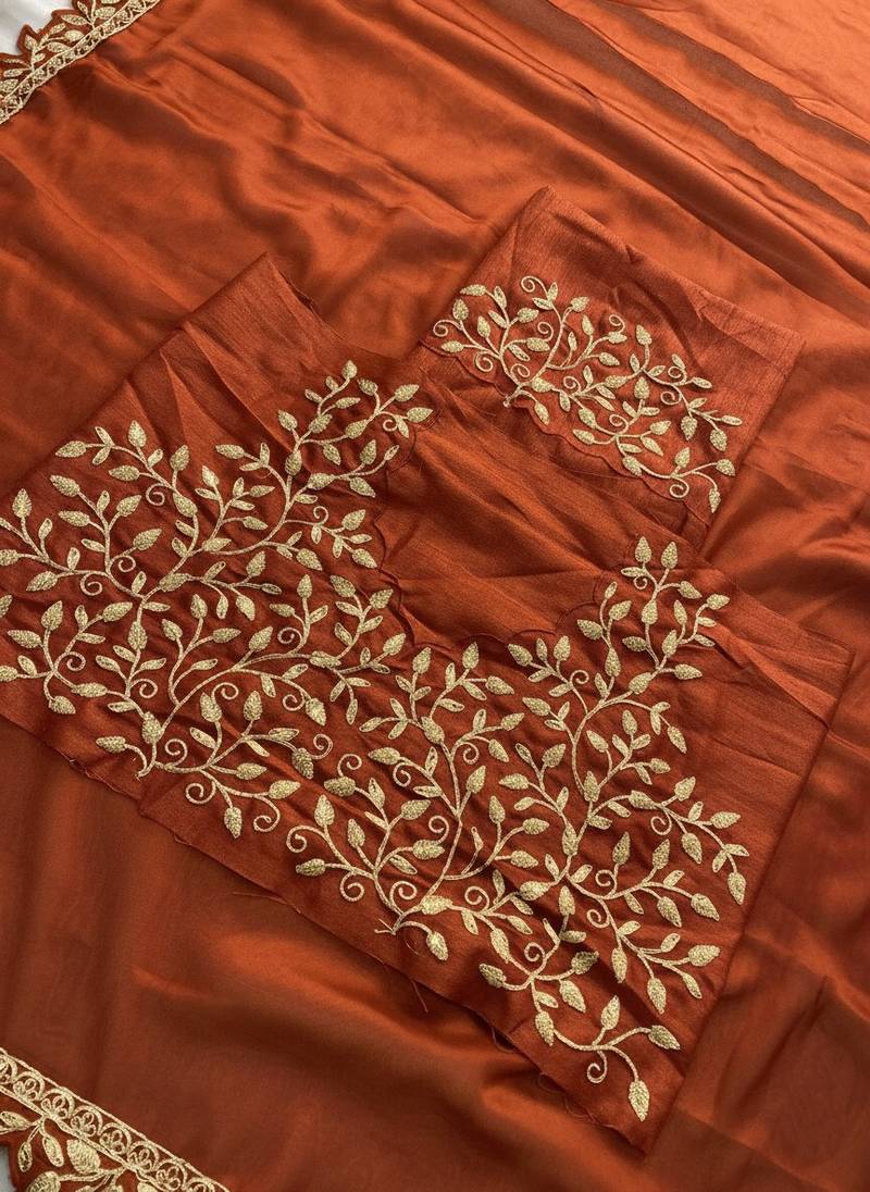 Appetizing orange embroidery cutwork work lace border rangoly silk party wear saree