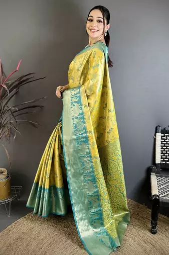 Yellow kanjeevaram silk blend woven design saree with unstitched blouse piece