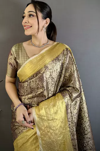 Brown kanjeevaram silk blend woven design saree with unstitched blouse piece