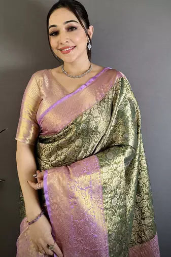 Bottle green kanjeevaram silk blend woven design saree with unstitched blouse piece