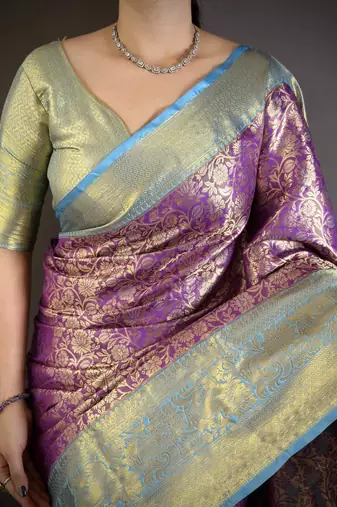 Purple kanjeevaram silk blend woven design saree with unstitched blouse piece
