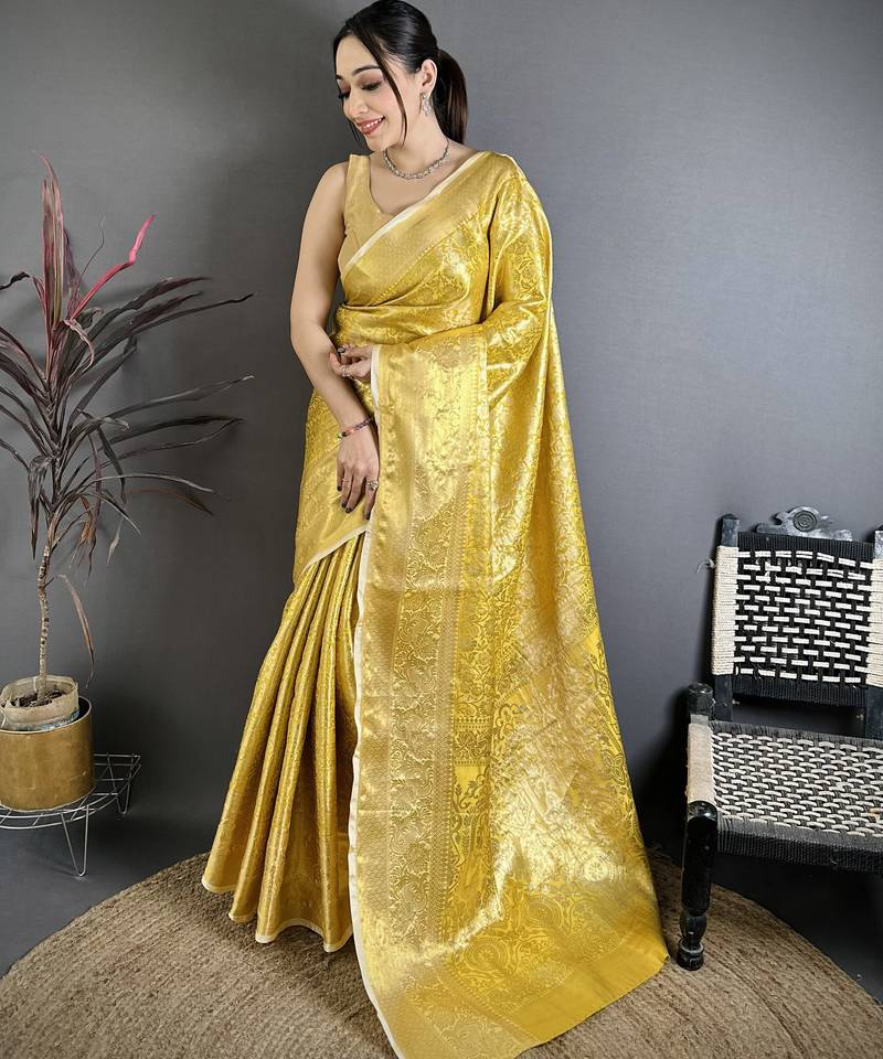 Yellow kanjeevaram silk woven design saree with unstitched blouse piece