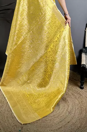 Yellow kanjeevaram silk blend woven design saree with unstitched blouse piece