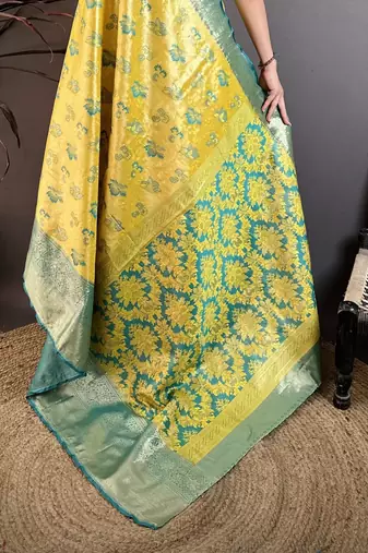 Yellow kanjeevaram silk blend woven design saree with unstitched blouse piece