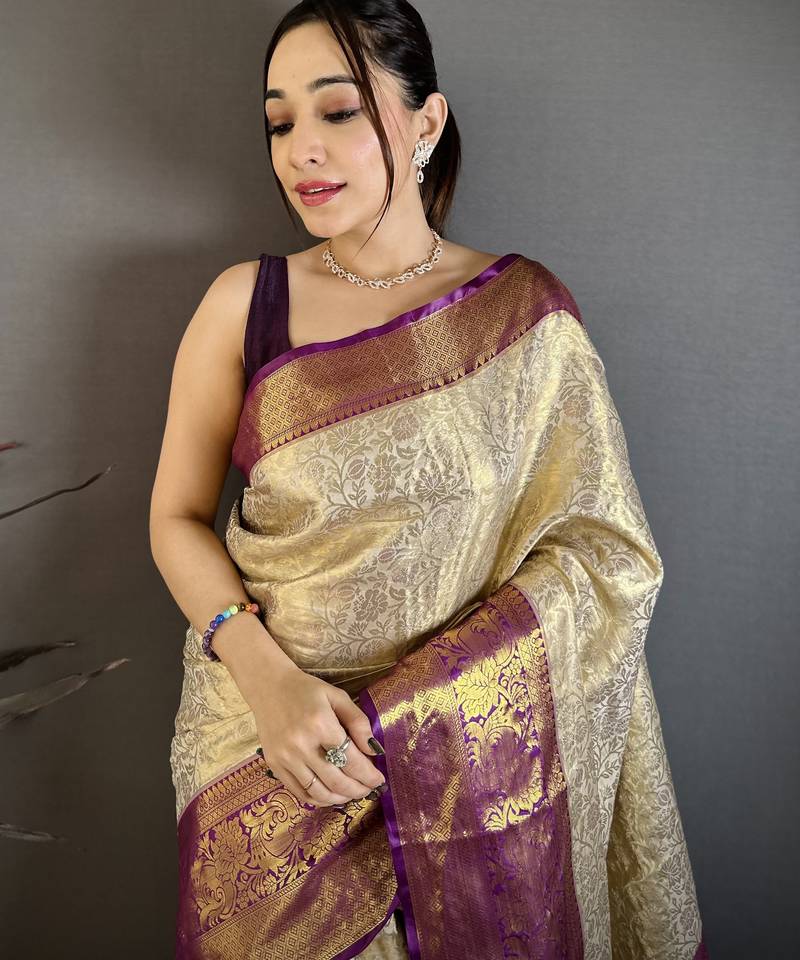 Cream kanjeevaram silk blend woven design saree with unstitched blouse piece