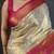 Cream kanjeevaram silk blend woven design saree with unstitched blouse piece