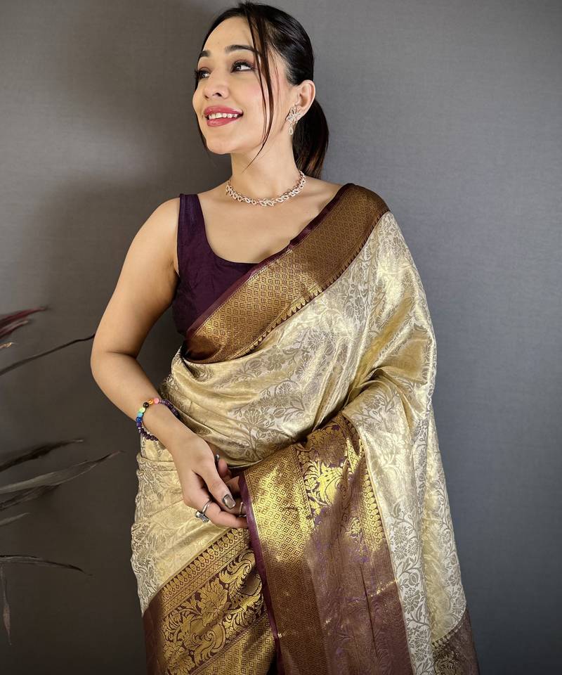 Cream kanjeevaram silk blend woven design saree with unstitched blouse piece