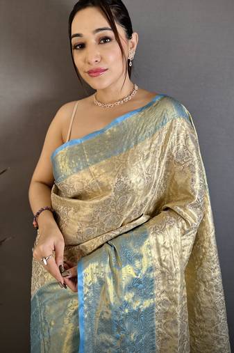 Cream kanjeevaram silk blend woven design saree with unstitched blouse piece