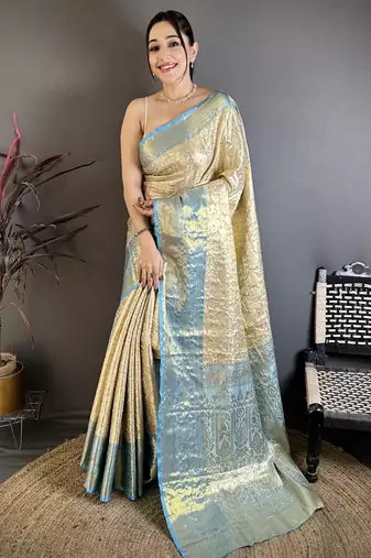 Cream kanjeevaram silk blend woven design saree with unstitched blouse piece