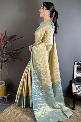 Cream kanjeevaram silk blend woven design saree with unstitched blouse piece