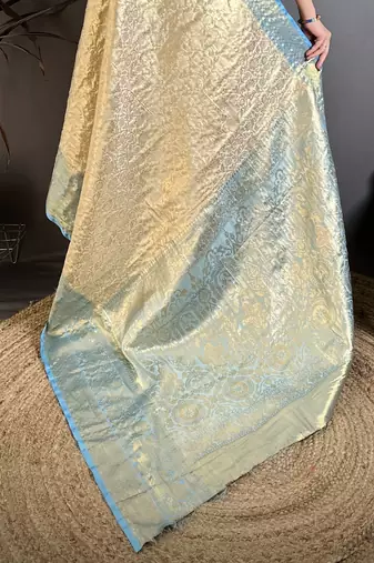 Cream kanjeevaram silk blend woven design saree with unstitched blouse piece