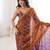 Rust tissue embridered saree with unstitched blouse piece